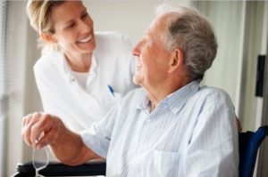Caregiver smiling at alzheimer's patient